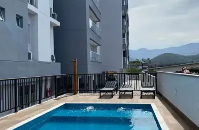 Ubatuba, centro, apartamento com 02 dormitórios sendo 01 suíte com área de lazer.