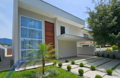 Ubatuba - condomínio park hills, casa nova com 04 suítes e área de lazer.