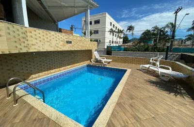 Casa em condomínio na praia do morro com 3 quartos, área de churrasqueira e piscina.