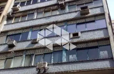 Sala comercial desocupada no centro, com 48,60 m² de área privativa, reformada.