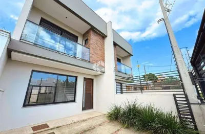 Casa nova 3 dormitórios, 1 suíte com sacada, living 2 ambientes, churrasqueira, no bairro igara/canoas. aceita financiamento bancário e fgts