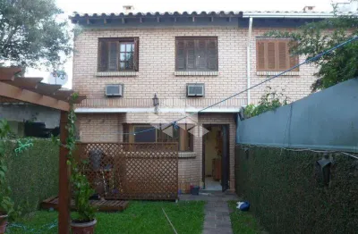 Casa com 3 quartos à venda na Rua Jacipuia, 268, Guarujá, Porto Alegre