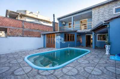 Casa sobrado 3 dormitórios, 1 suíte, área gourmet/churrasqueira, lavanderia, piscina /2 vagas, no bairro igara/ canoas. aceita negociação.