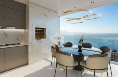Apartamento com 3 suítes e 2 vagas perto do mar em porto belo