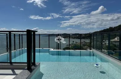 Apartamento com 2 quartos 1 suíte 1 vaga de garagem e vista parcial para o mar em cacupé florianópolis/sc