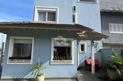 Casa com 3 quartos à venda na Rua Henrique Anawate, 470, Guarujá, Porto Alegre