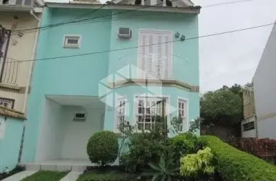 Casa em condomínio fechado com 3 quartos à venda na Rua Osório Mendes Ouriques, 332, Guarujá, Porto Alegre