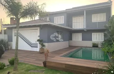 Casa sobrado de 2 dormitórios com suíte e piscina com aquecimento - moinhos de ventos, canoas