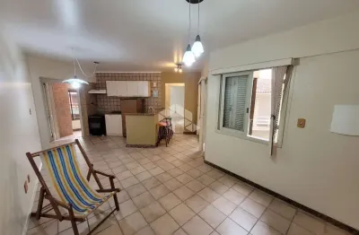 Apartamento a venda com 01 dormitório, sala, com sacada fechada, cozinha, área de serviço com churrasqueira, e box coberto