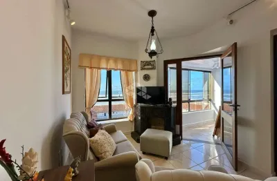 Apartamento de 3 dormitórios sacada com churrasqueira mobiliado, posição solar l/s/o no centro em capão da canoa