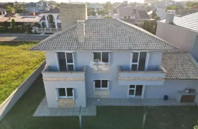 Sobrado à venda com 5 quartos/dormitórios e 2 vagas /box em atlântida xangri-lá/rs