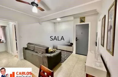 2 quartos na quadra da praia, bairro ponta da praia, prédio com elevador e garagem.