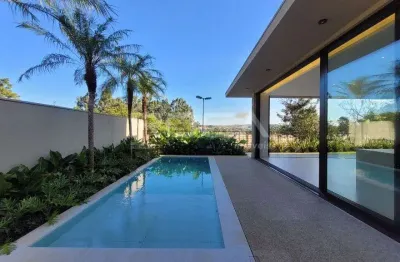 Casa sobrado à venda no condomínio reserva santa luisa, com 4 suítes.