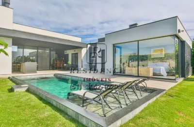 Luxuosa casa em condomínio à venda em belém novo, porto alegre-rs: 4 quartos, 4 suítes, áreas amplas e piscina aquecida!