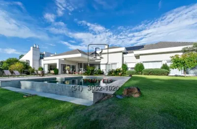 Casa em condomínio fechado com 4 quartos à venda na avenida juca batista, 8000, belém novo, porto alegre, 710 m2 por r$ 7.500.000