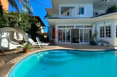 Casa com 4 quartos à venda na rua das tainhas, 144, jurerê internacional, florianópolis por r$ 5.490.000