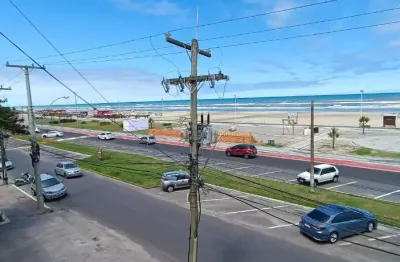 Apartamento á beira mar com sacada de frente em capão da canoa
