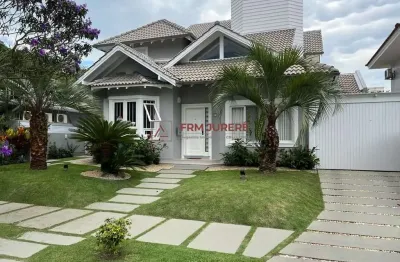 Casa com 4 quartos à venda na rua das piraúnas, 31, jurerê internacional, florianópolis por r$ 4.500.000