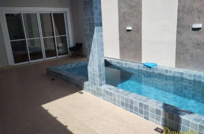 Casa geminada com piscina de 2 dormitórios, sendo 1 suíte no maracanã em praia grande sp.