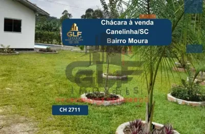 Chácara a venda na cidade de canelinha/sc no bairro moura, com 3.200 m². chácara completa com lavoura, árvores frutíferas, criação de aves e muito mai