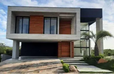 Viva o luxo e conforto em 452m² de puro requinte: 4 suítes e área de lazer completa