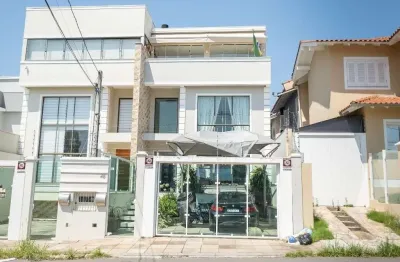 Encante-se com esta casa de alto padrão no bairro reserva dom feliciano!
