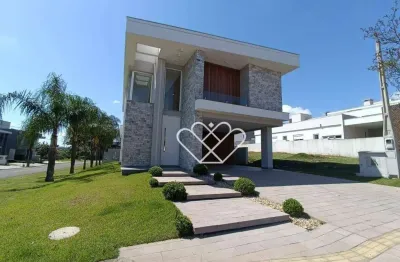 Casa de alto padrão com 3 suítes, piscina e churrasqueira em condomínio exclusivo