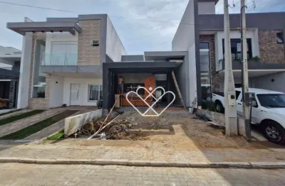 Casa de alto padrão com 3 dormitórios, suíte e churrasqueira em condomínio exclusivo