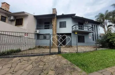 Casa à venda no bairro Dom Feliciano em Gravataí com ampla área construída