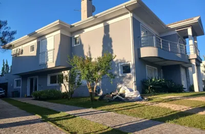 Luxo no alphaville graciosa: 5 suítes, piscina aquecida e terreno de 903m²