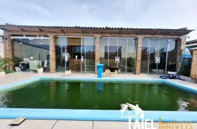 Incrível residência com piscina, 3 dormitórios, 1 suíte na praia de quintão/rs