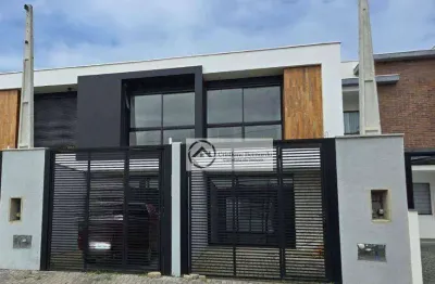 Sobrado com arquitetura moderna, com 3 suítes, na praia grande em são francisco do sul