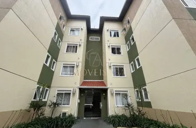 Apartamento semimobiliado com suíte, sacada com churrasqueira e garagem coberta