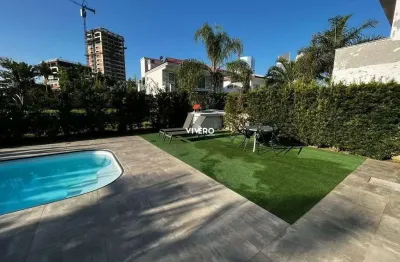 Casa no condomínio horizontal praia brava com 04 suítes, excelente localização n