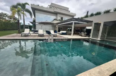 Casa triplex a venda no condomínio alphaville de alto padrão e sofisticação com 6 suítes e espaço para 6 vagas de garagem com uma infraestrutura impecável - barra da tijuca