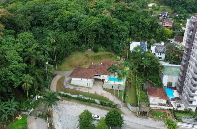 Casa plana averbada com 4 quartos ( 2 suítes) à venda no bairro saguaçu em joinville - sc por r$ 2.800.000,00.