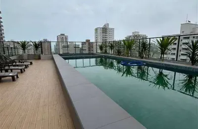 470mil 2 dormitorios 1 suite - novo - na guilhermina com piscina na cobertura e churrasqueira na sacada .