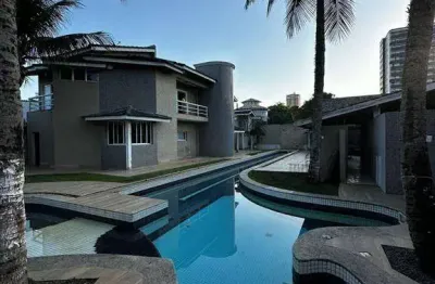 4,85 milhao casa espetacular no bairro do canto do forte, altissímo padrão, piscina e espaço de lazer de cinema.
