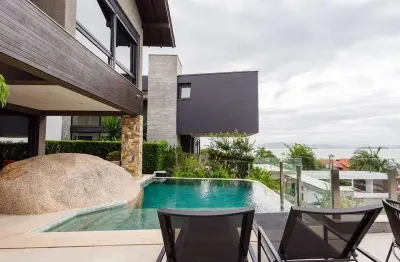 Casa em condomínio fechado com 4 quartos à venda na estrada haroldo soares glavan, 4942, cacupé, florianópolis, 435 m2 por r$ 6.900.000