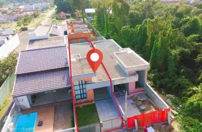 Ótima casa geminada a venda em guaratuba com 3 quartos (1 suíte) com piscina e garagem