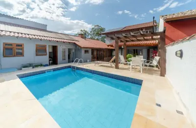 Casa em condomínio fechado com 3 quartos à venda na avenida juca batista, --, cavalhada, porto alegre por r$ 1.600.000