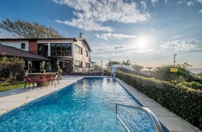 Casa com 5 quartos à venda na rua coroados, --, vila assunção, porto alegre por r$ 4.240.000
