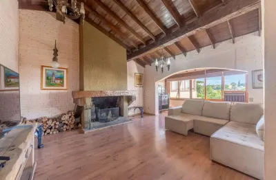 Casa com 4 quartos à venda na Rua Caeté, --, Vila Assunção, Porto Alegre por R$ 1.080.000