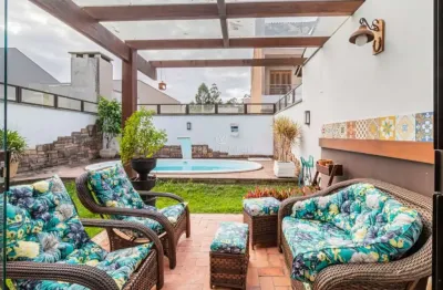 Casa com 3 quartos à venda na rua corticeira, --, hípica, porto alegre por r$ 730.000