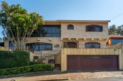 Casa com 3 quartos à venda na rua dos guenoas, --, guarujá, porto alegre por r$ 2.330.000