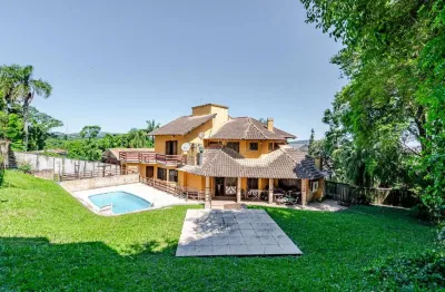 Casa com 4 quartos à venda na avenida coronel marcos, --, pedra redonda, porto alegre por r$ 2.100.000