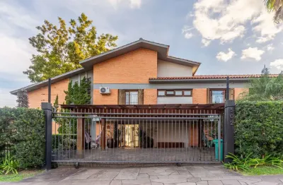Casa com 4 quartos à venda na rua caeté, --, vila assunção, porto alegre por r$ 2.700.000