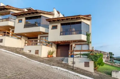 Casa em condomínio fechado com 3 quartos à venda na rua alcebíades antônio dos santos, --, nonoai, porto alegre por r$ 895.000