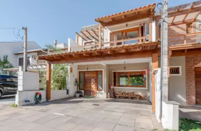 Casa em condomínio fechado com 3 quartos à venda na rua carlos maximiliano fayet, --, hípica, porto alegre por r$ 980.000