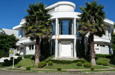 Casa com 4 quartos à venda na avenida dos dourados, 210, jurerê internacional, florianópolis por r$ 7.700.000